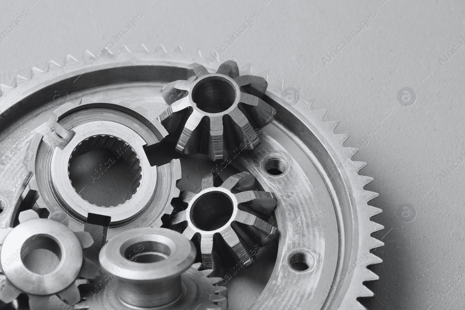 Photo of Different stainless steel gears on light grey background