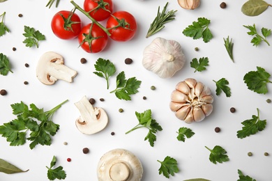 Photo of Flat lay composition with green parsley, rosemary, pepper and vegetables on white background