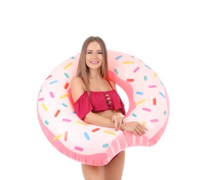 Photo of Sexy young woman in bikini with inflatable ring on white background