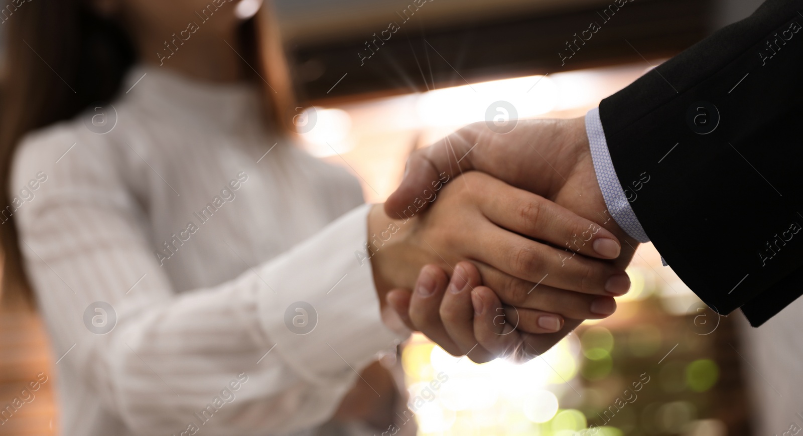 Image of Business partners shaking hands after meeting in office, closeup. Banner design