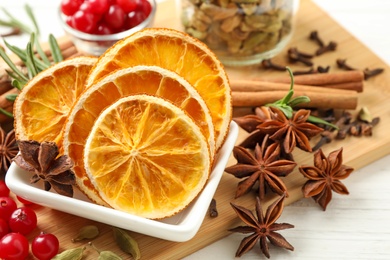 Photo of Composition with mulled wine ingredients on white wooden table, closeup