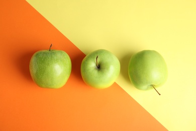 Photo of Flat lay composition of fresh ripe green apples on color background