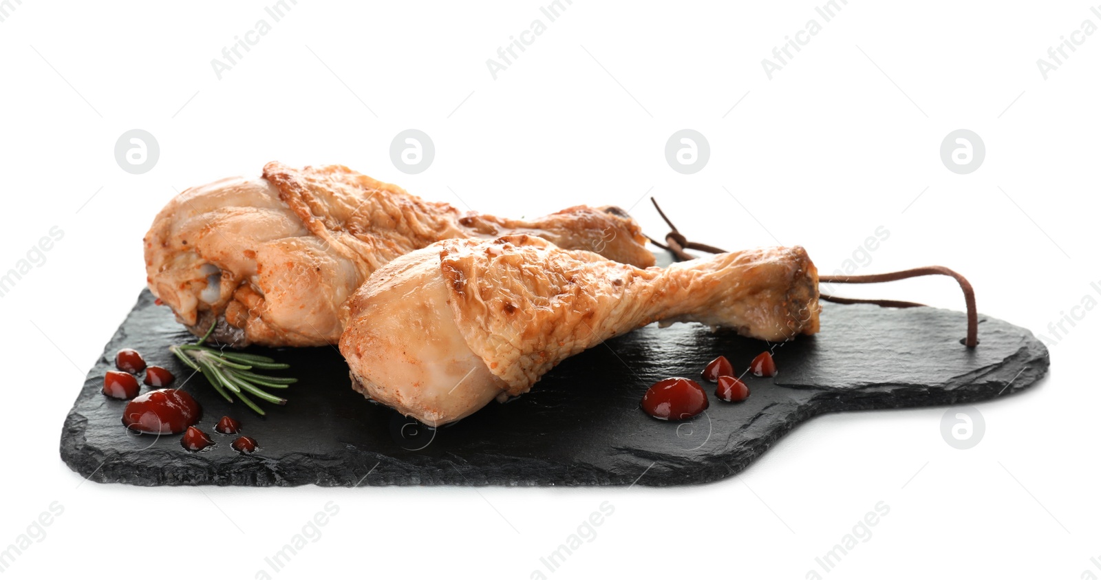 Photo of Board with fried chicken drumsticks on white background. Delicious meat