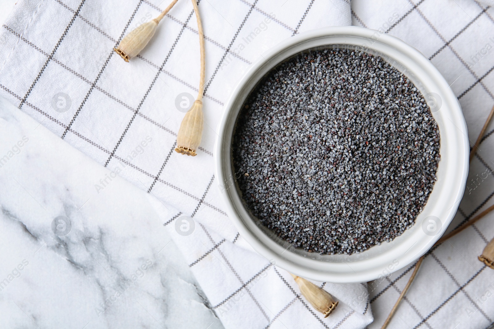 Photo of Flat lay composition with poppy seeds on marble background