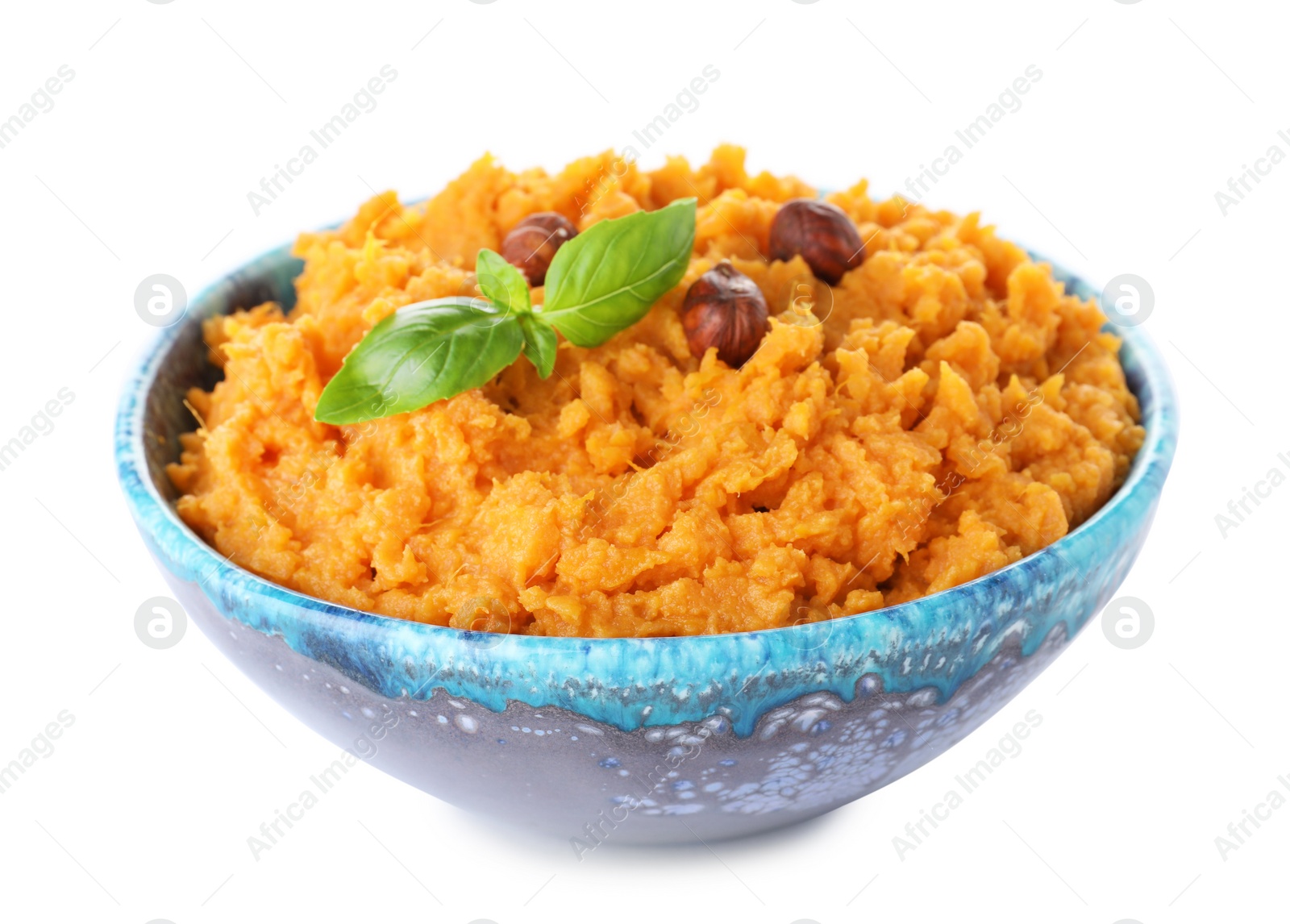 Photo of Bowl with mashed sweet potatoes on white background