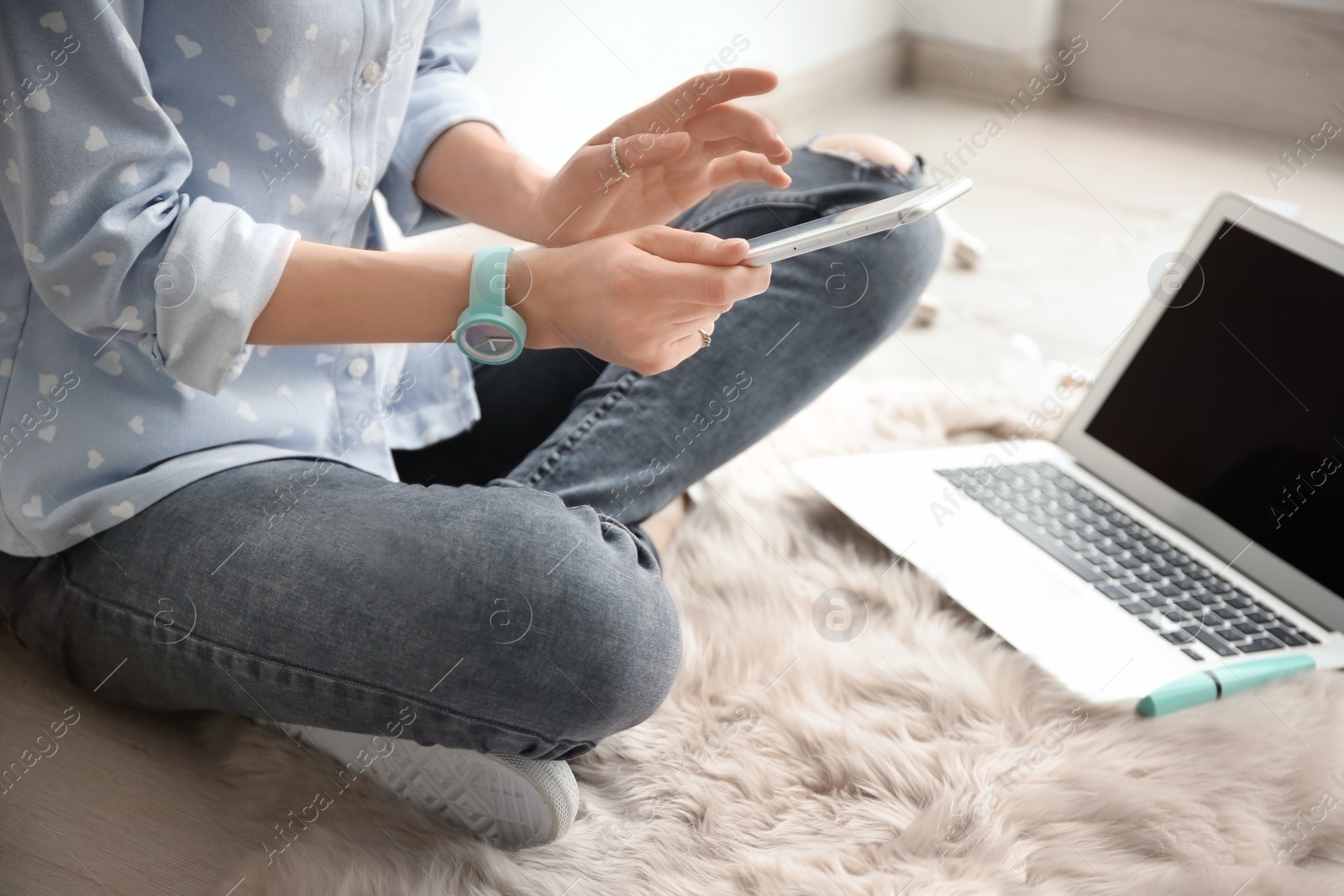 Photo of Female blogger with smartphone indoors