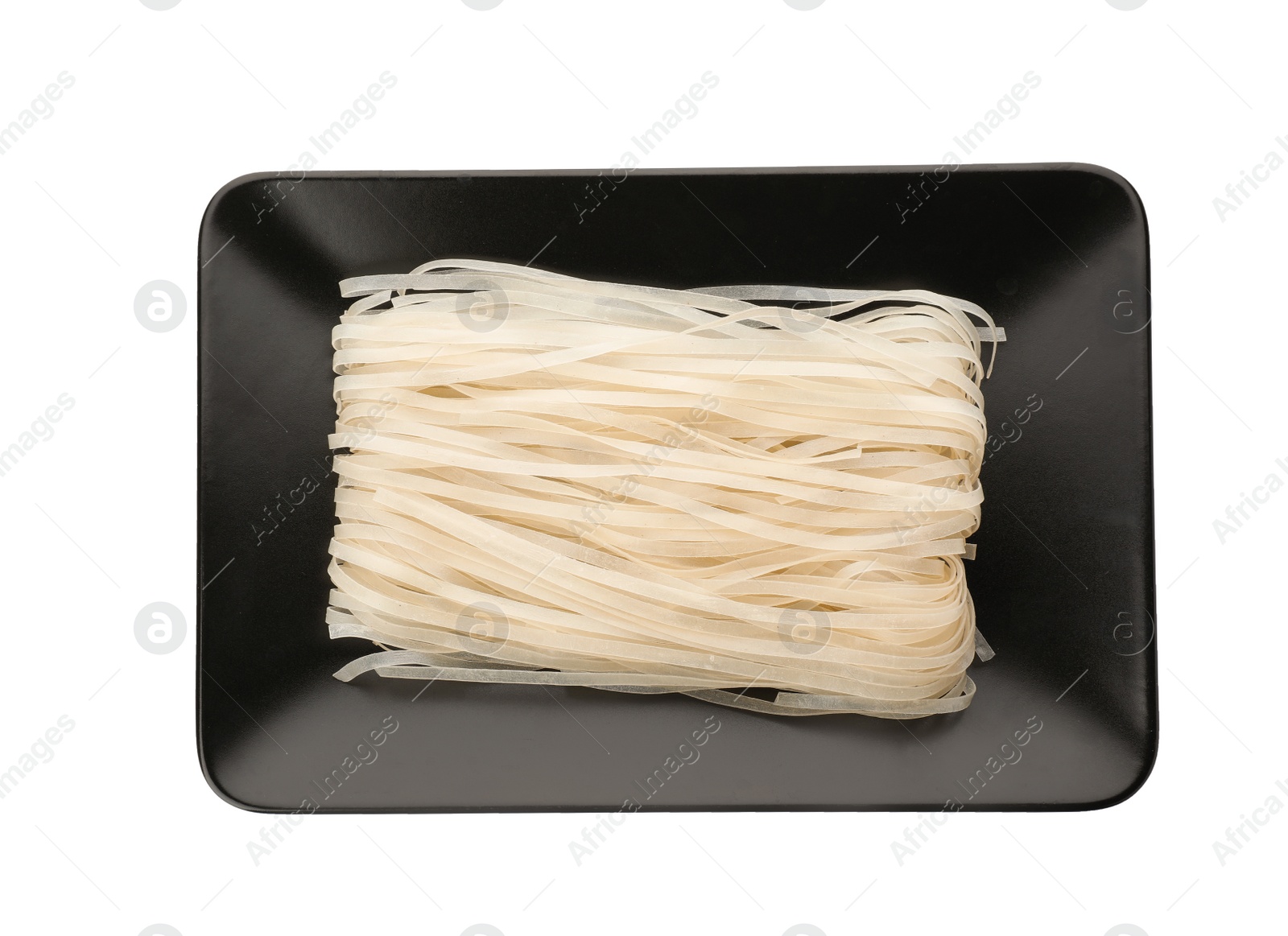 Photo of Plate with raw rice noodles on white background, top view