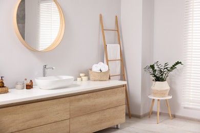 Beautiful stylish interior of bathroom with mirror and wash basin