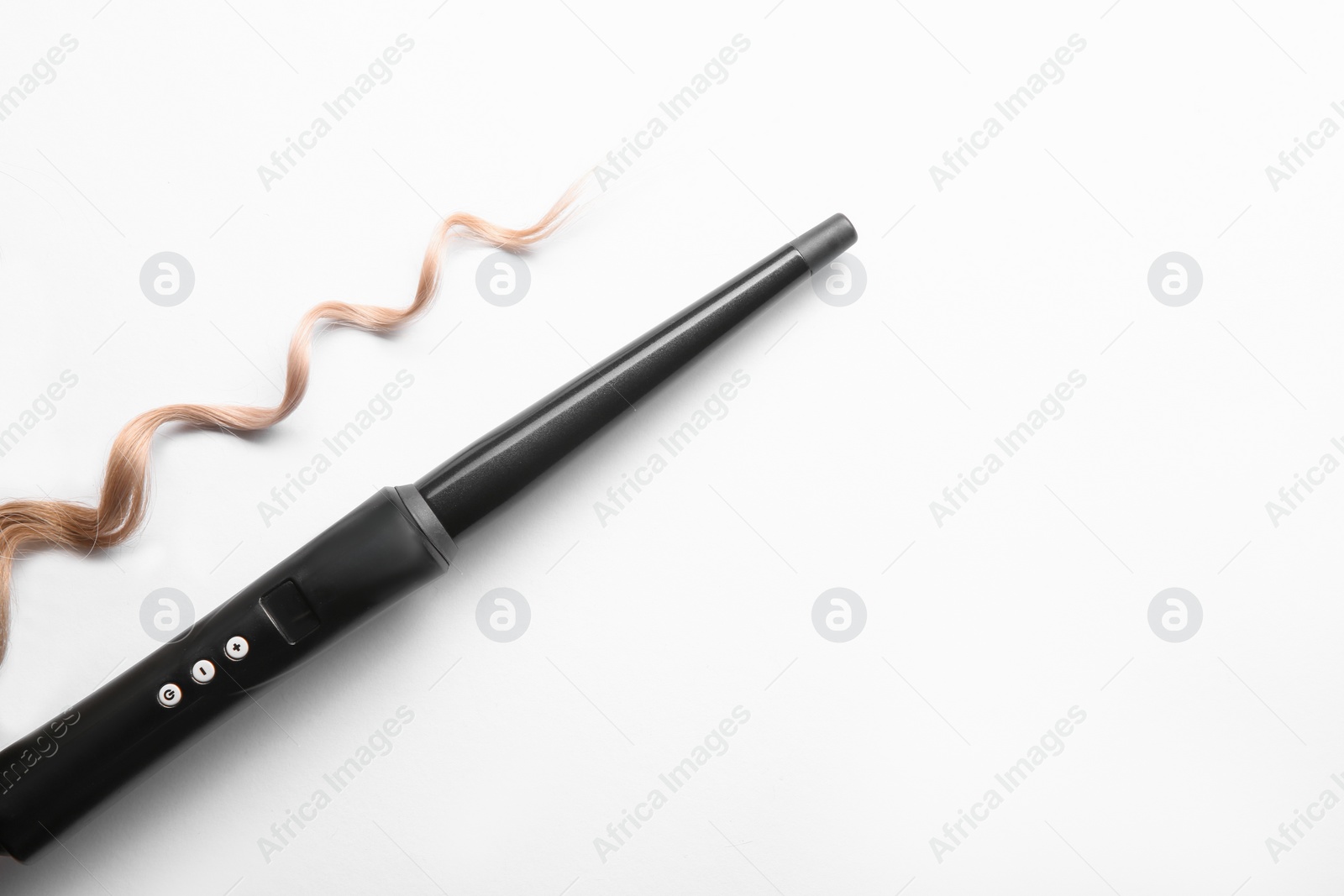 Photo of Modern clipless curling iron and blonde hair lock on white background