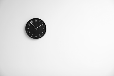 Photo of Stylish clock on white background. Time concept