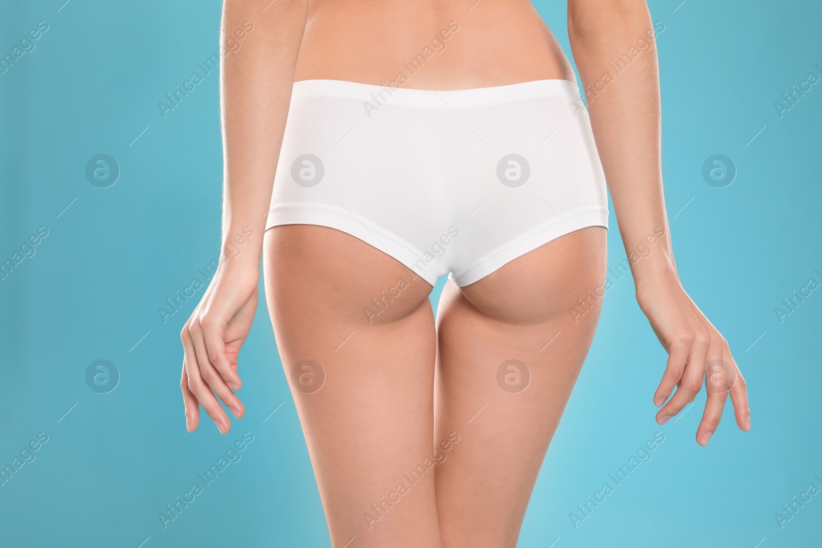 Photo of Slim young woman with smooth gentle skin on color background, closeup. Beauty and body care concept