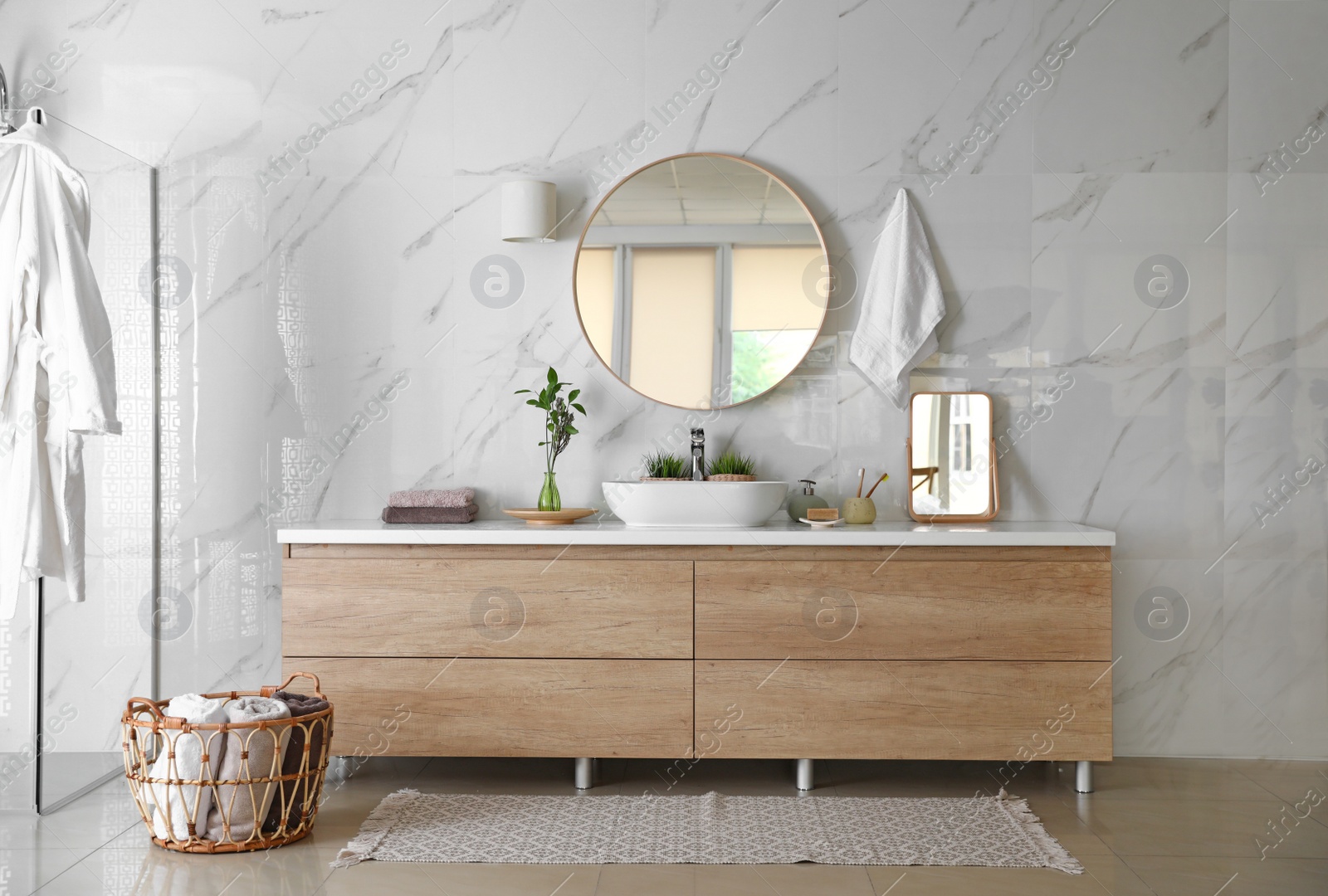 Photo of Modern bathroom interior with stylish mirror, vessel sink and glass shower stall