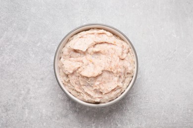 Delicious lard spread in bowl on light table, top view