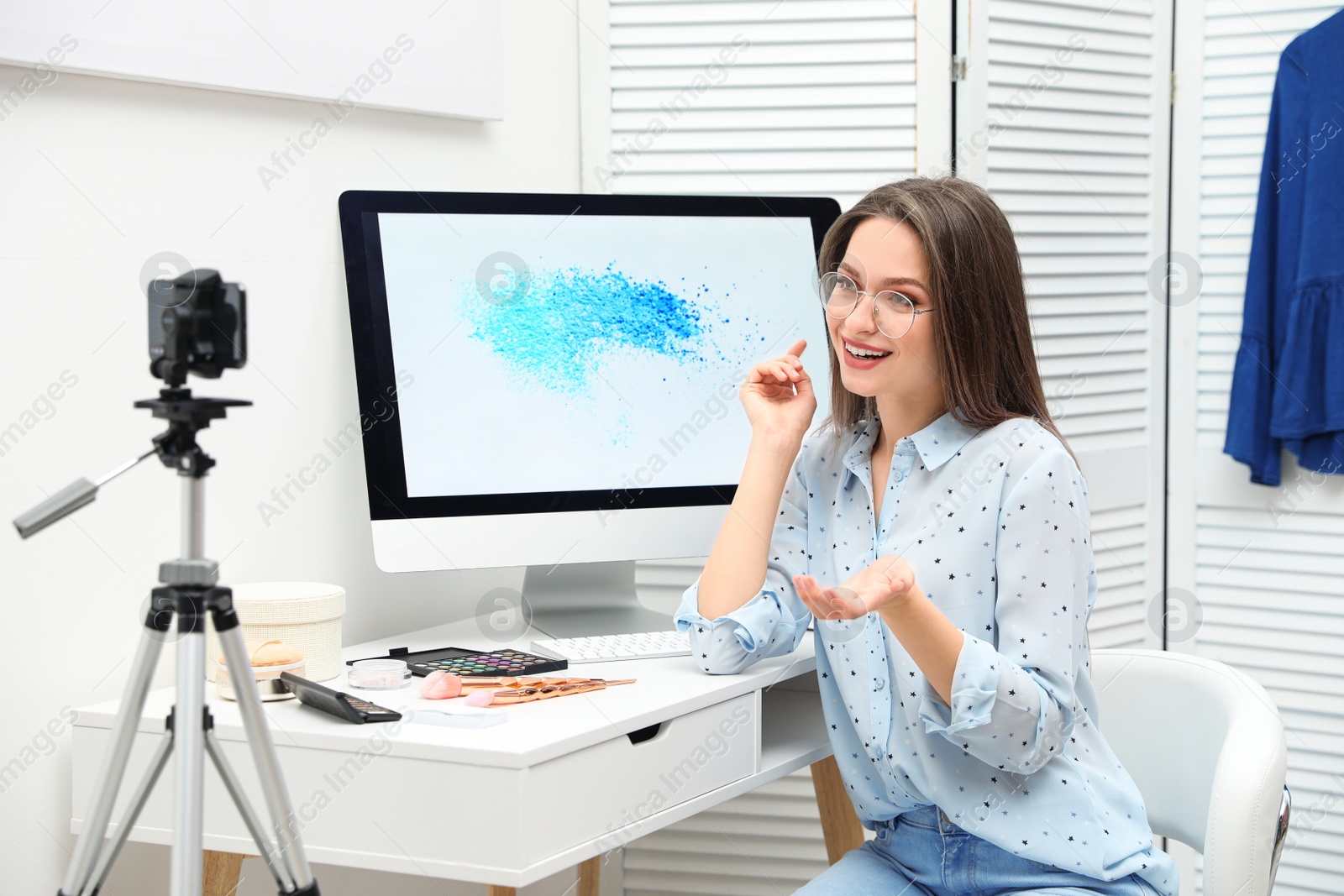 Photo of Beauty blogger filming make up tutorial at home