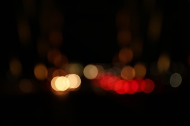 Photo of Blurred view of city lights at night. Bokeh effect