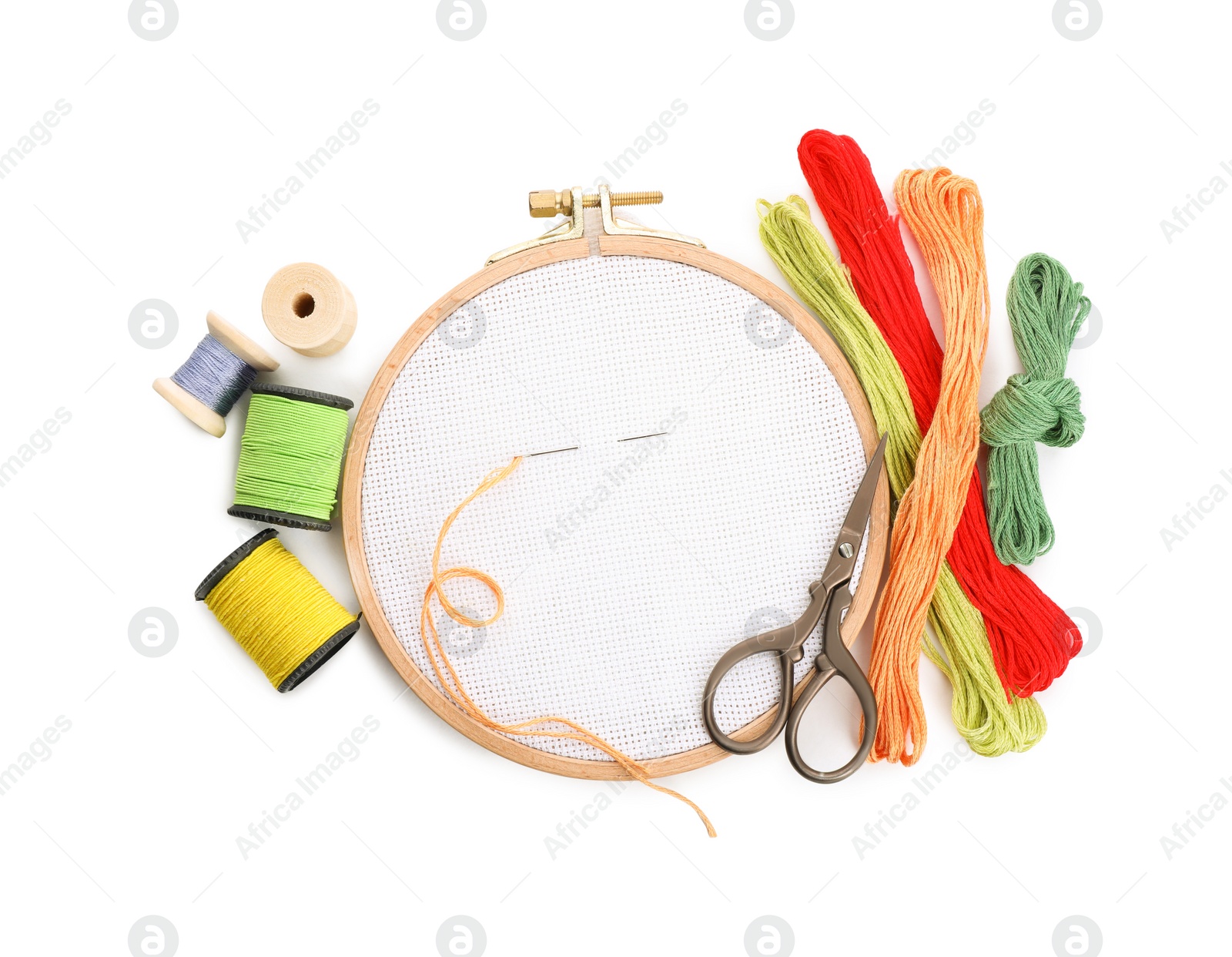 Photo of Set of embroidery equipment on white background, top view
