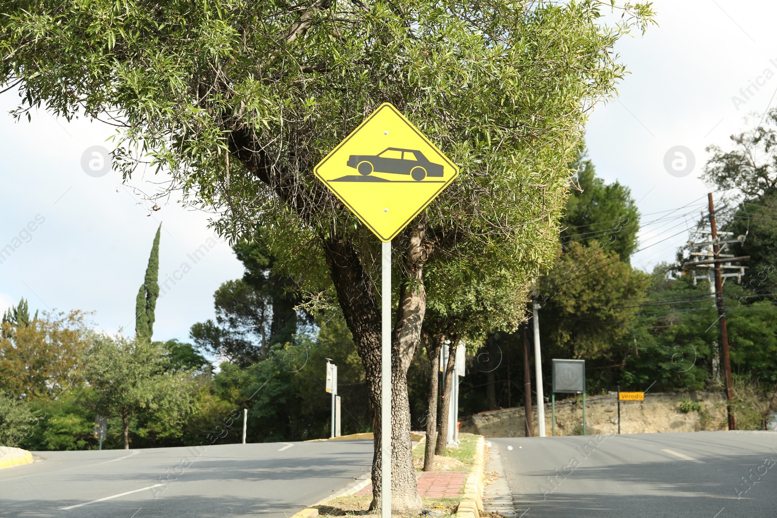 Photo of Speed bump road sign on city street