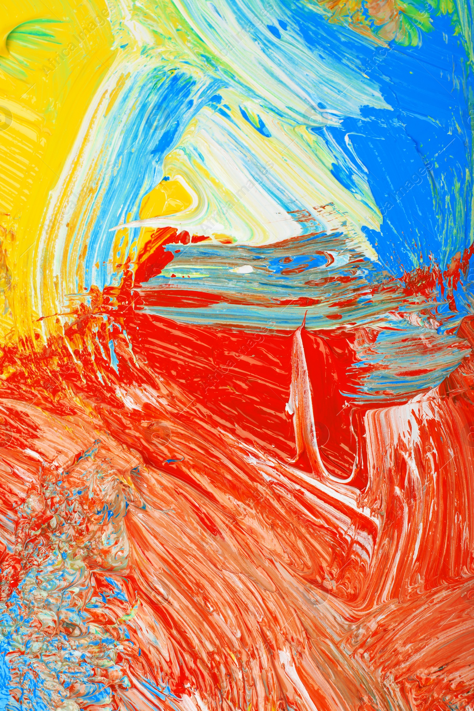 Photo of Closeup view of artist's palette with mixed bright paints as background