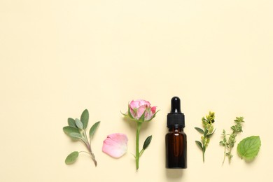 Bottle of essential oil, different herbs and rose flower on beige background, flat lay. Space for text