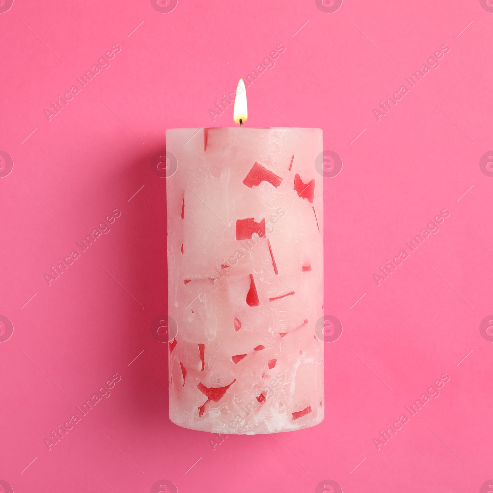 Photo of Alight scented wax candle on color background