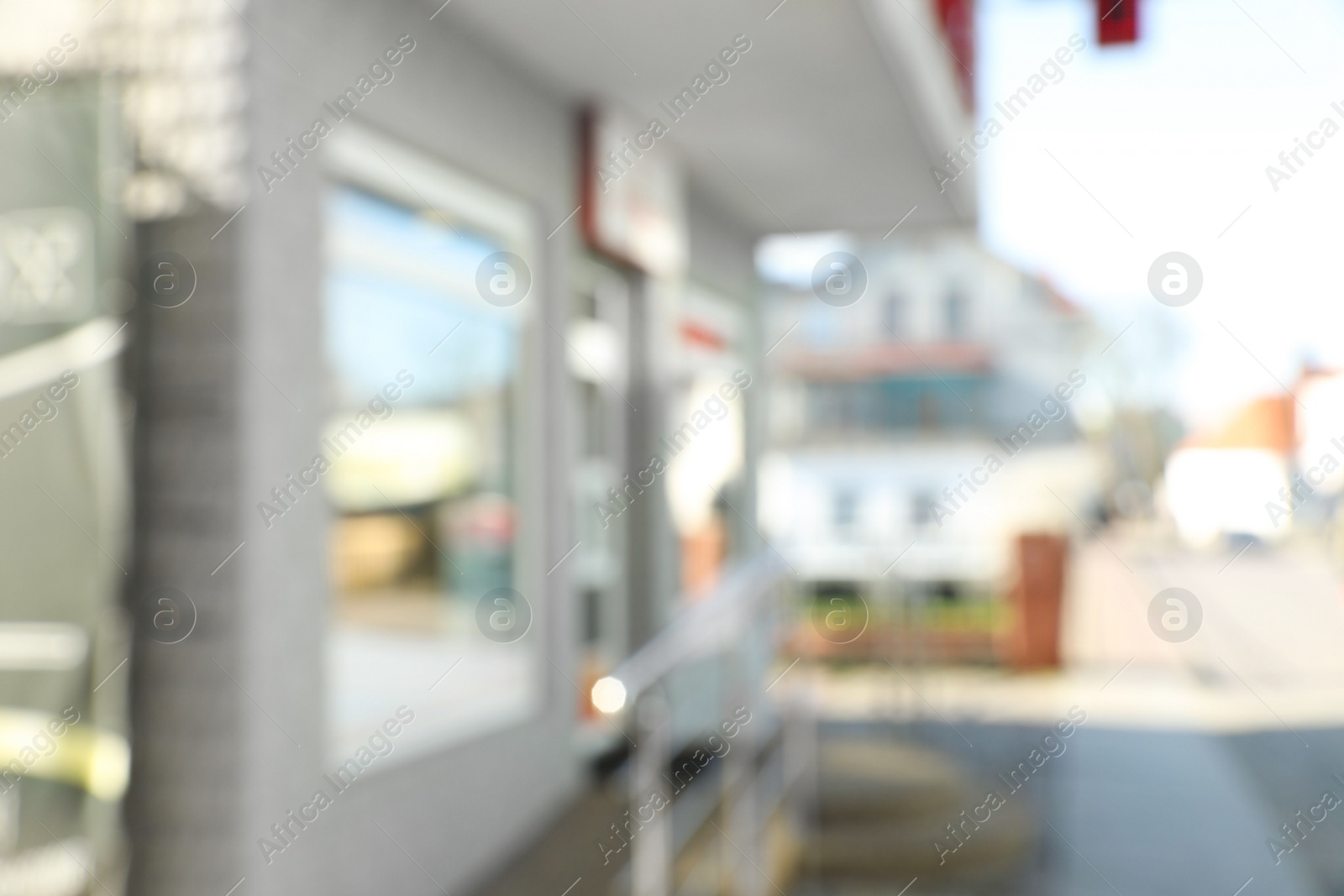 Photo of Blurred view of store exterior and city street. Bokeh effect