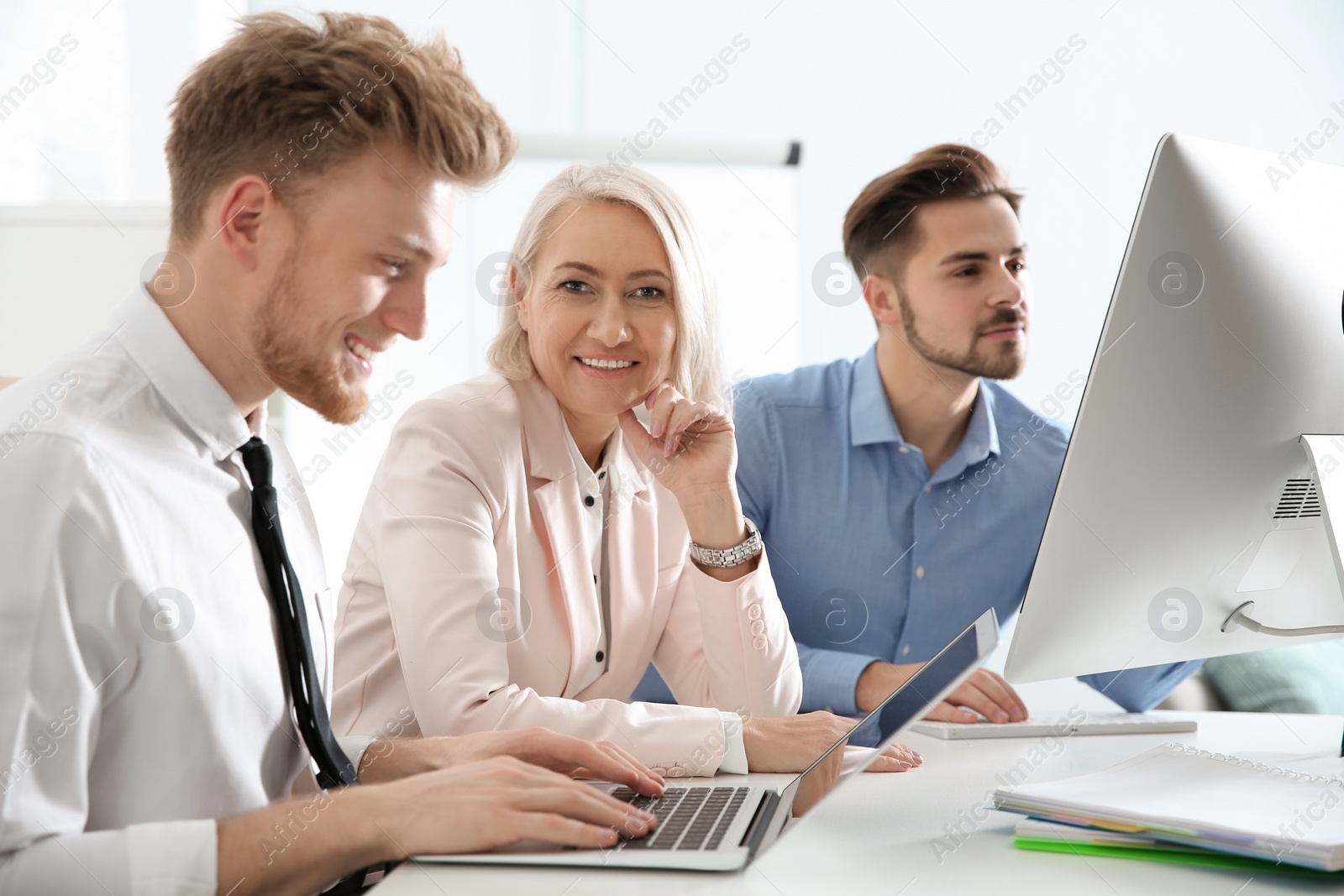 Photo of Business people working at table. Professional communication