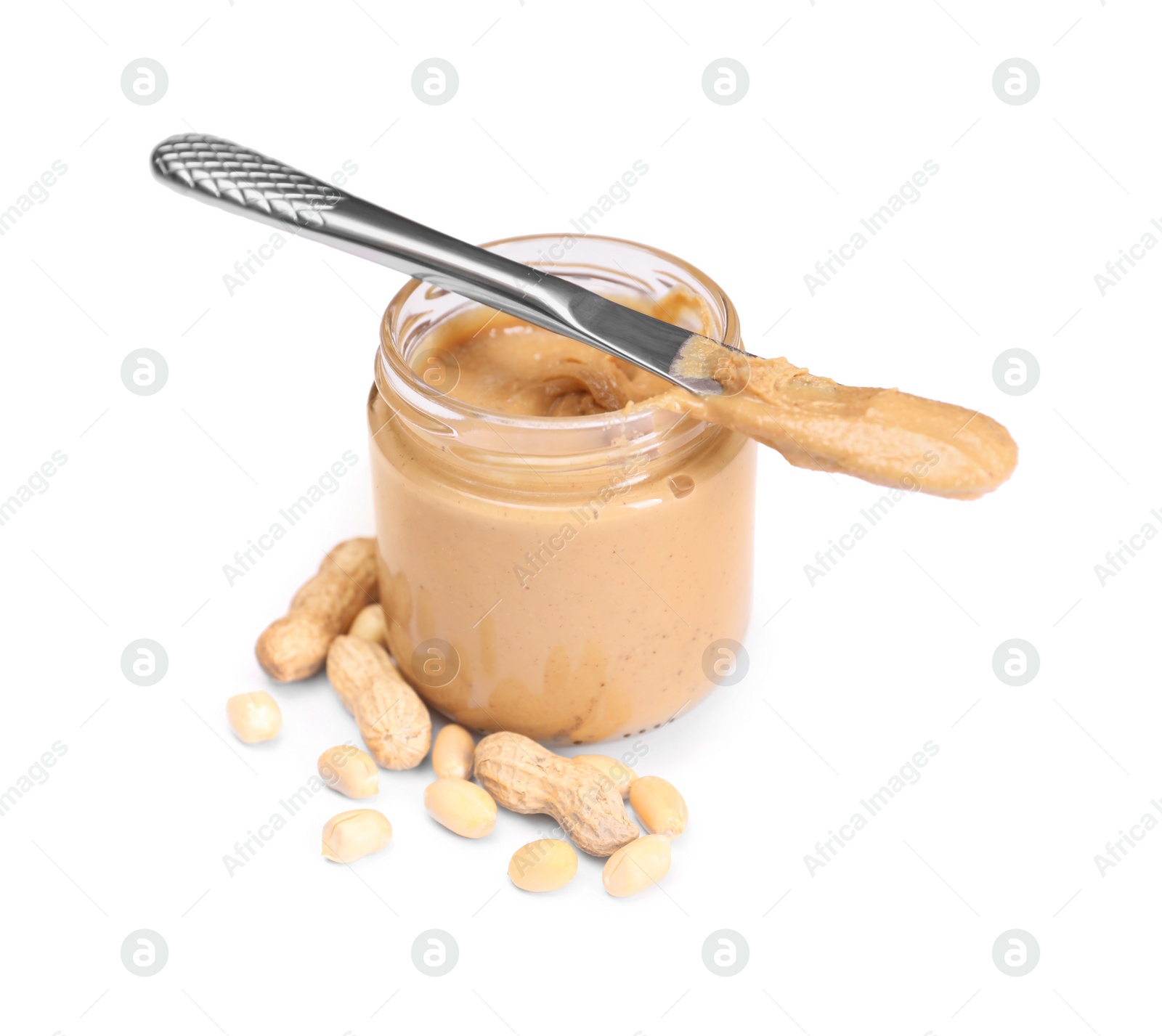 Photo of Tasty nut paste in jar, knife and peanuts isolated on white