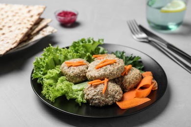 Photo of Plate of traditional Passover (Pesach) gefilte fish on light table
