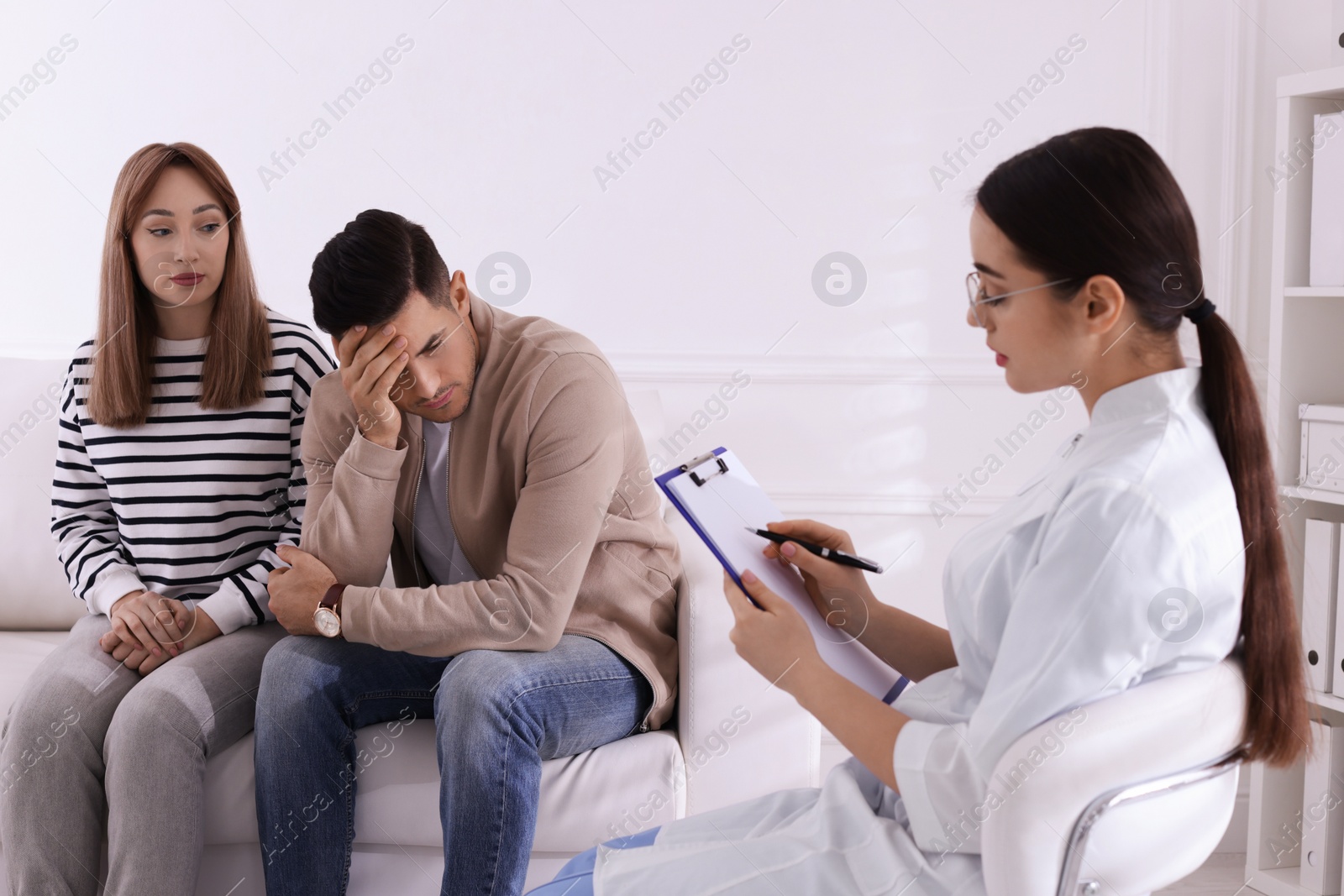 Photo of Couple having appointment with STD specialist in clinic