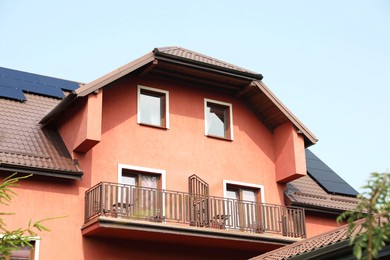 Photo of View of house with balconies and solar panels on roof