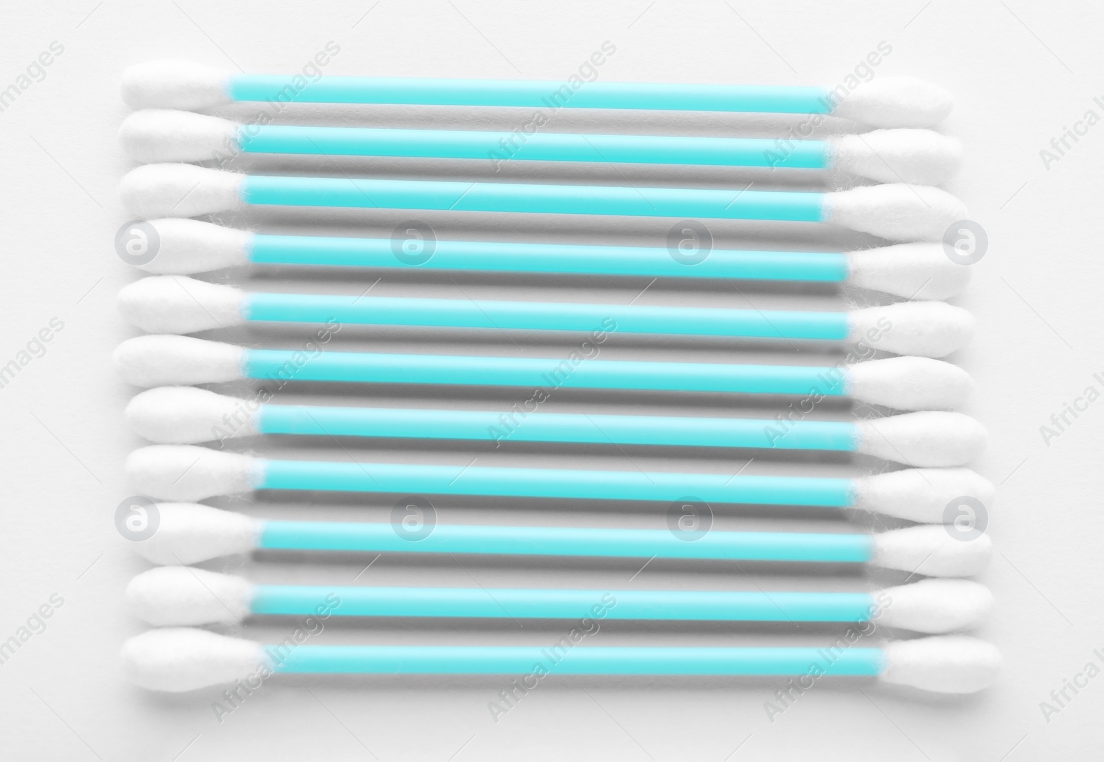 Photo of Many clean cotton buds on white background, top view