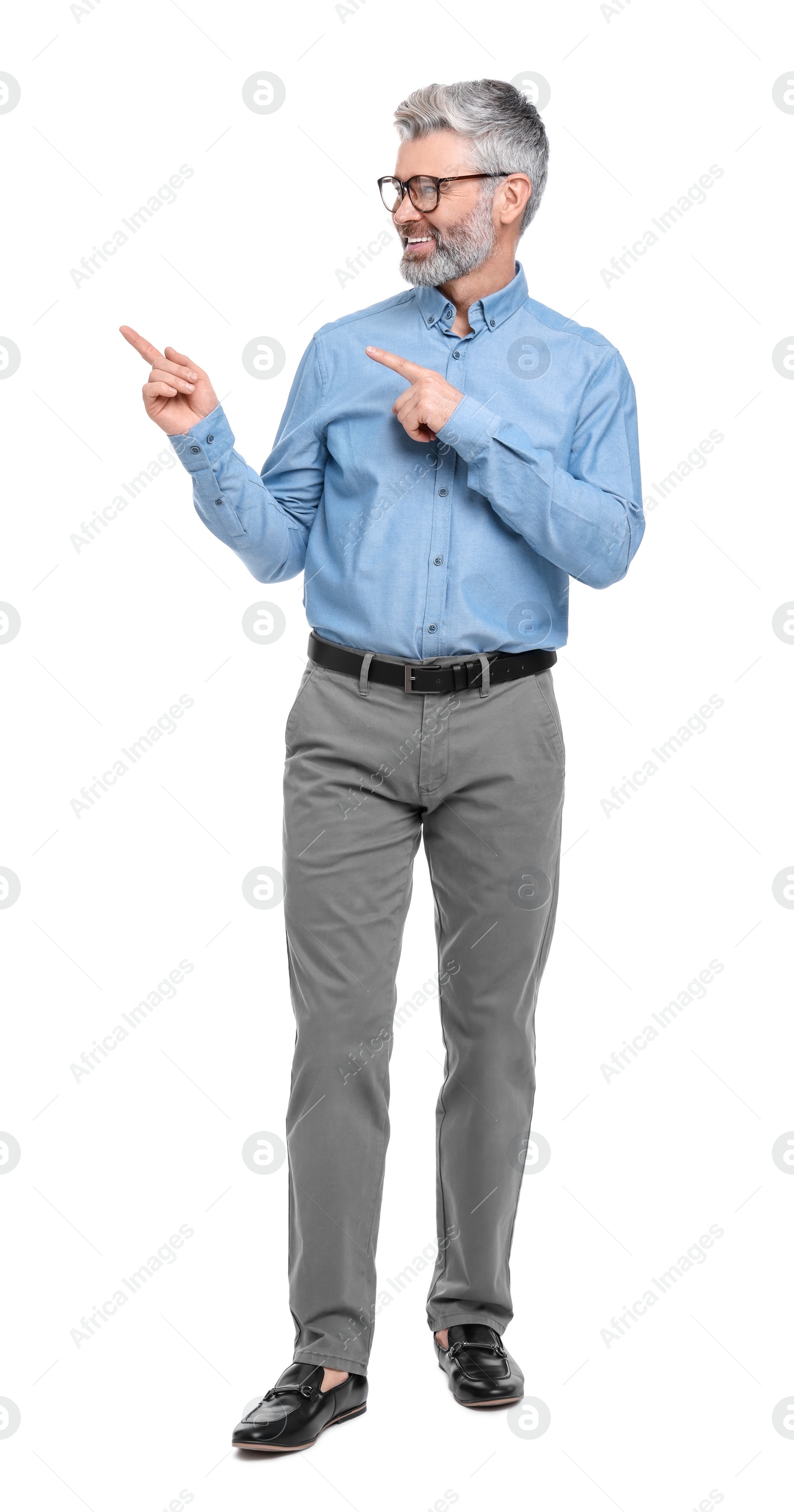 Photo of Mature businessman in stylish clothes posing on white background