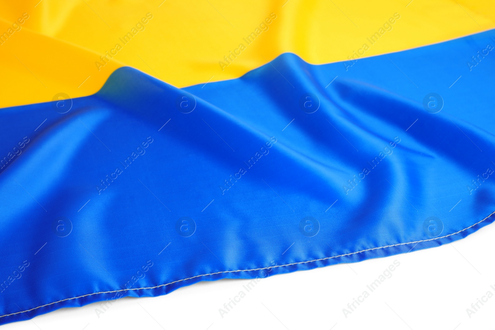 Photo of National flag of Ukraine on white background, closeup