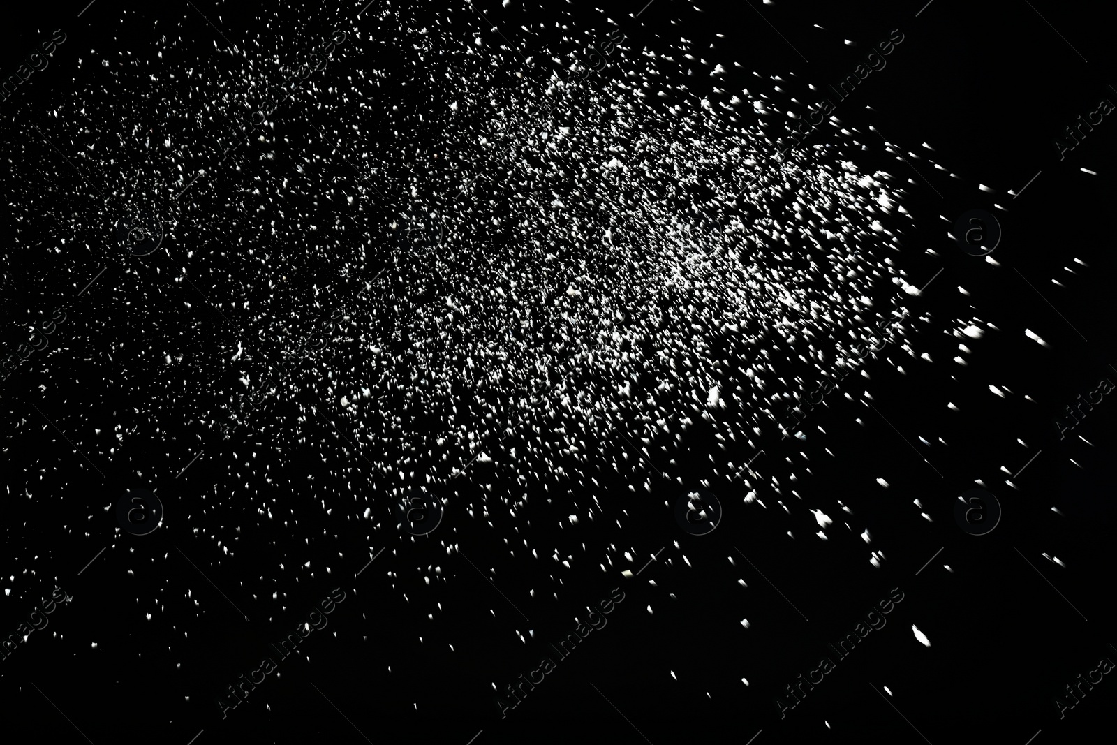 Photo of Snow flakes falling on black background. Winter weather