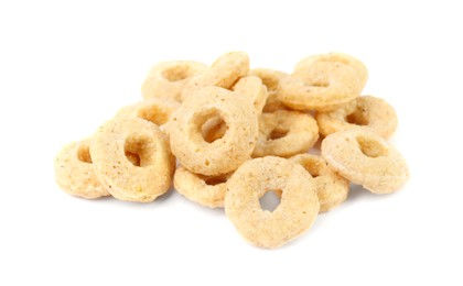 Photo of Pile of tasty corn rings on white background, closeup. Healthy breakfast cereal