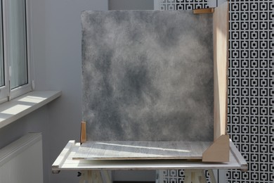 Photo of Double-sided backdrops on table in photo studio
