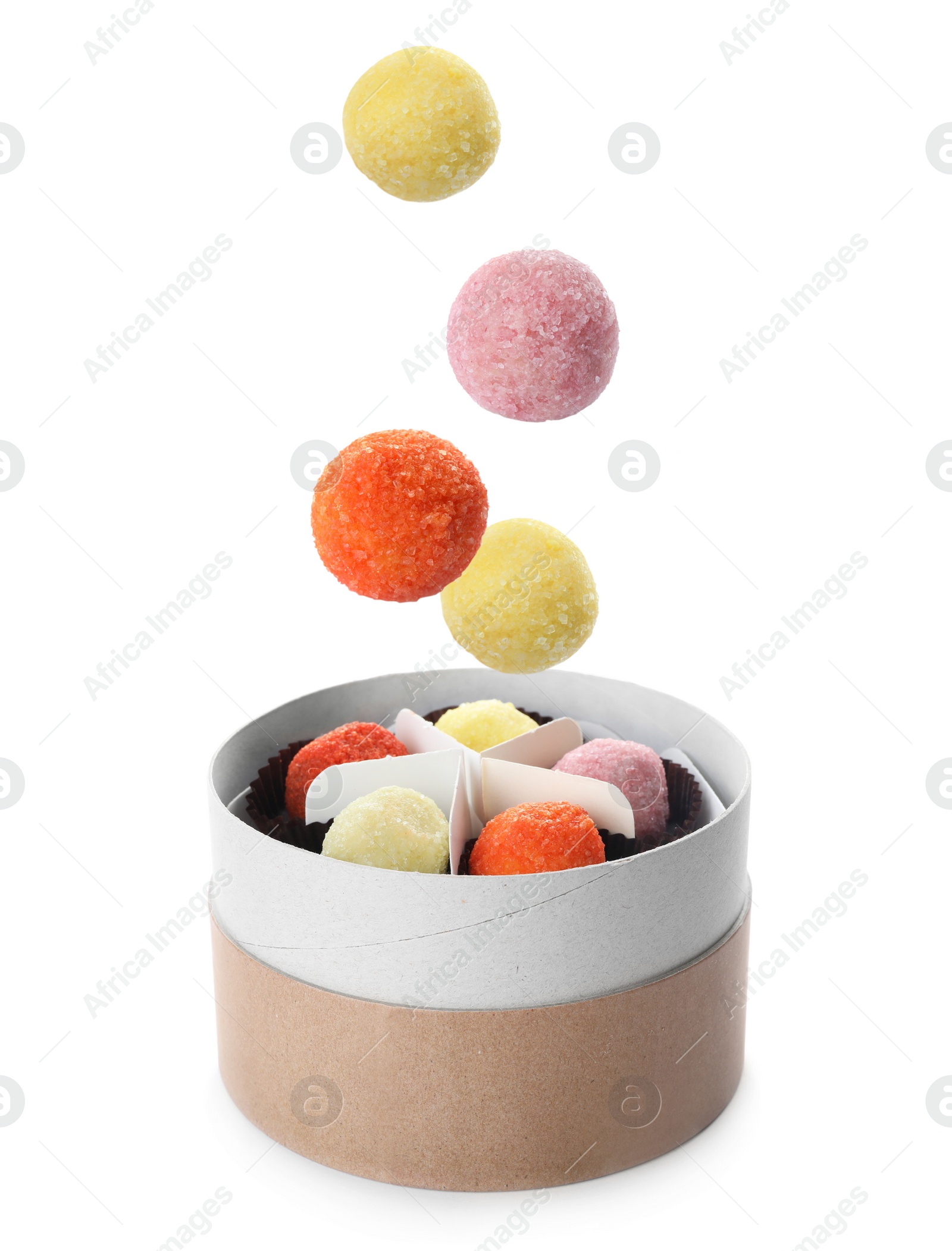 Image of Colorful chocolate candies falling into box on white background