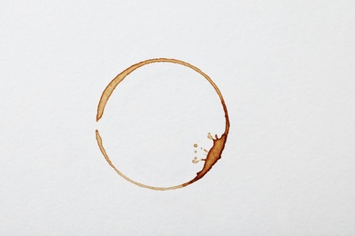 Photo of Dried coffee cup stain on white background, top view