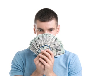 Handsome young man with dollars on white background