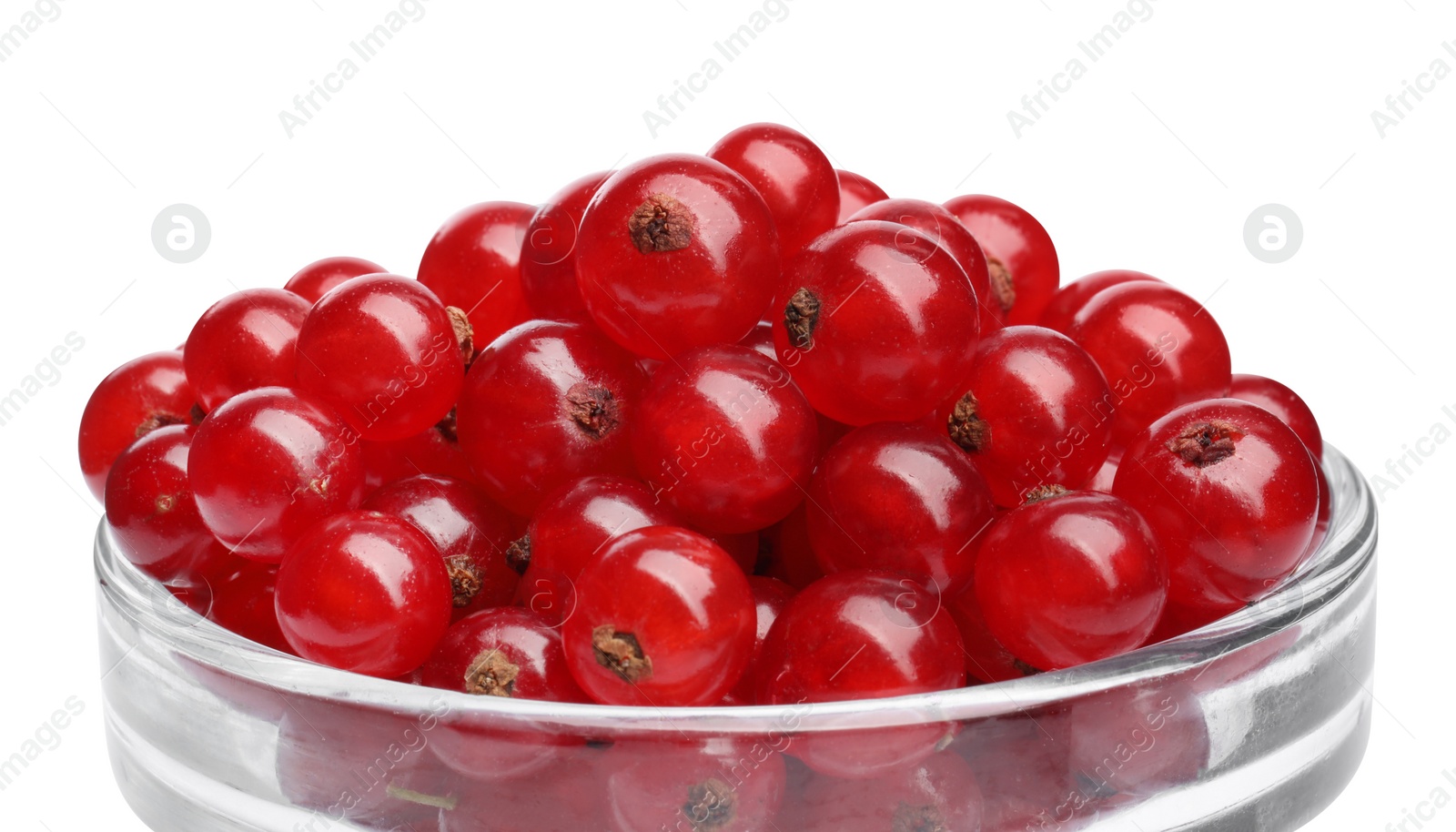 Photo of Tasty ripe redcurrants in glass bowl isolated on white