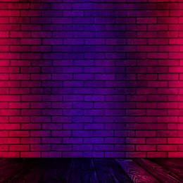 Image of Room with brick wall and wooden floor in neon lights