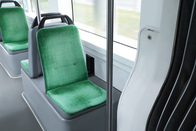 Photo of Public transport interior with comfortable green seats