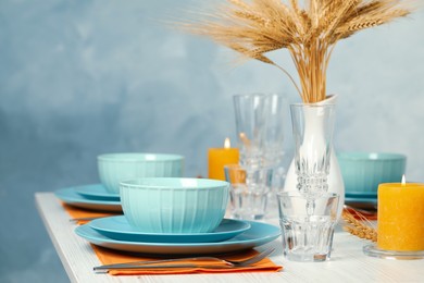 Elegant festive setting on white wooden table