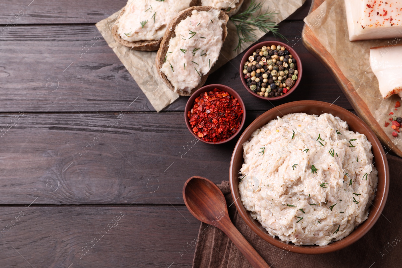Photo of Delicious lard spread served on wooden table, flat lay. Space for text