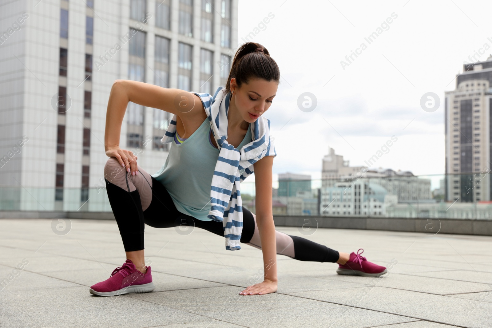 Photo of Beautiful woman doing fitness exercise in morning outdoors