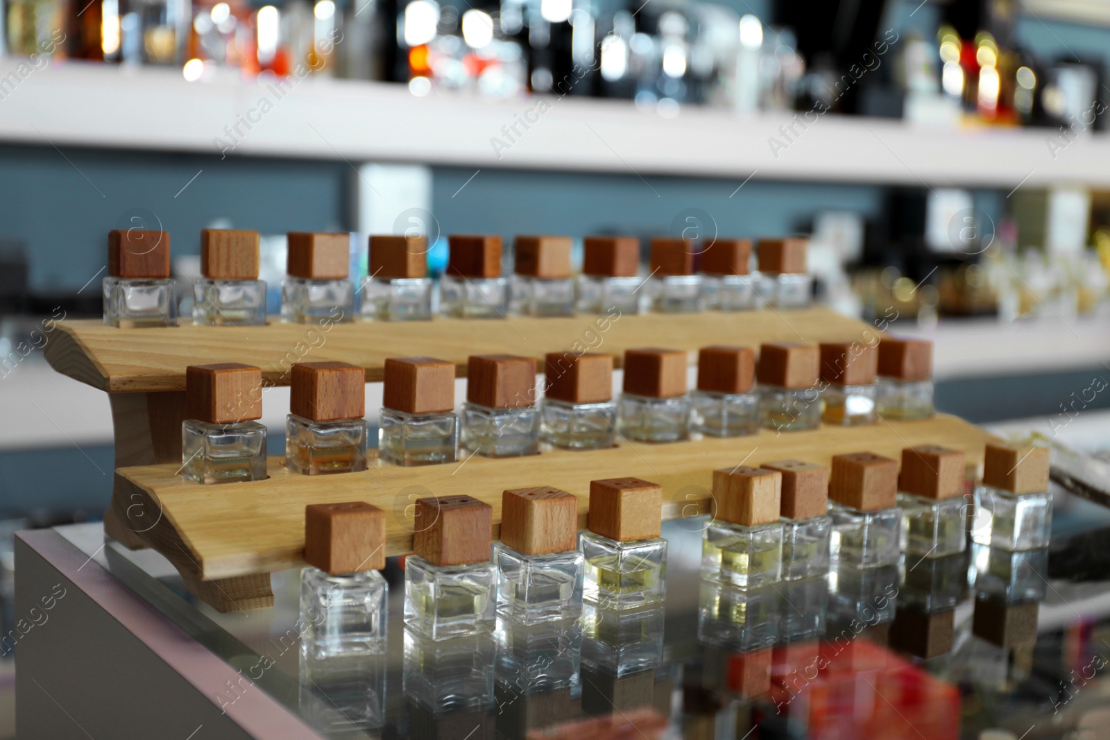 Image of Perfume bottles on glass counter in shop