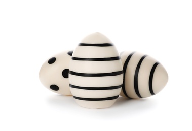Photo of Set of traditional Easter eggs decorated with black paint on white background