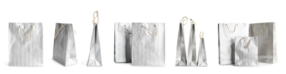 Image of Set of paper shopping bags on white background. Banner design