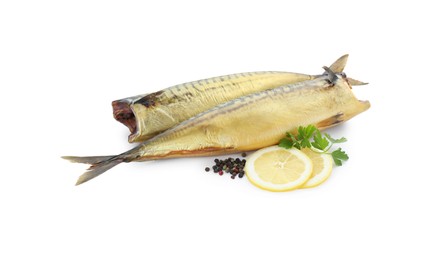 Delicious smoked mackerels, lemon slices and spices on white background