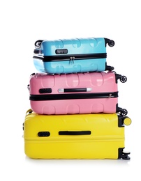 Modern suitcases for travelling on white background